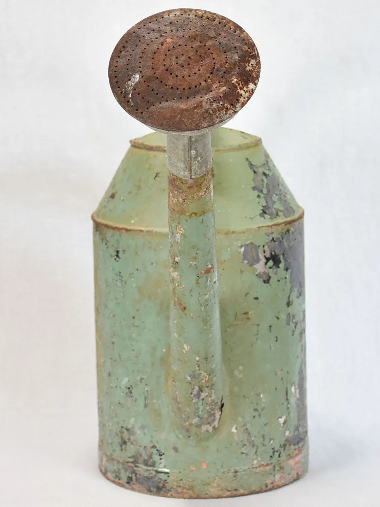 French watering can with green patina
